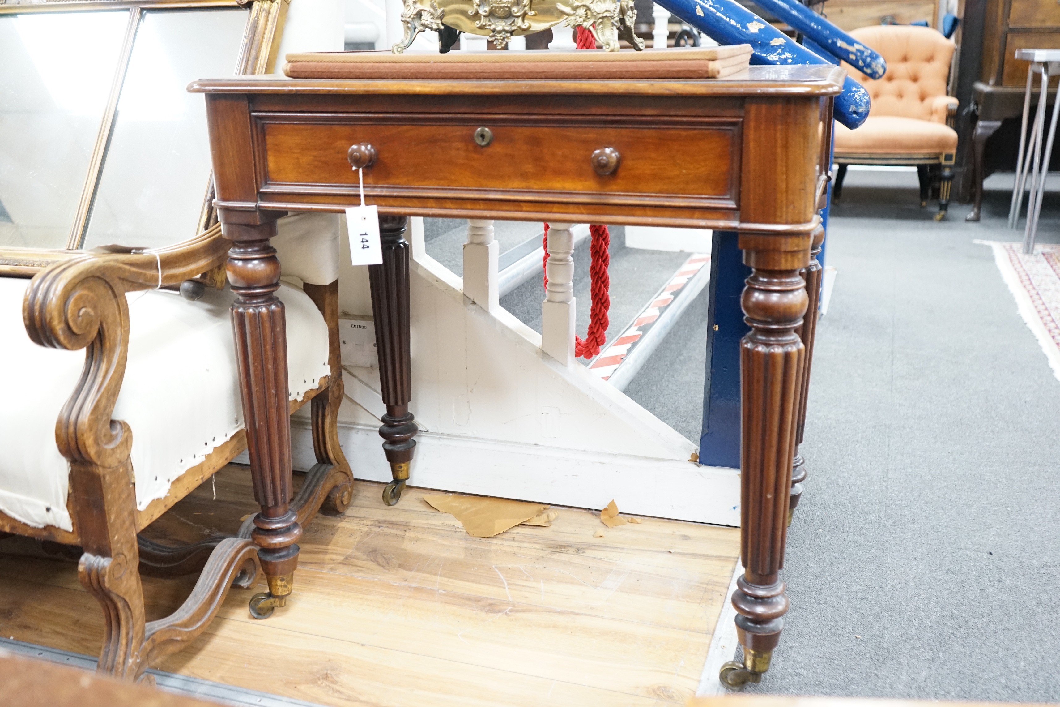 An early Victorian mahogany writing table stamped M Willson, 68 Great Queen Street, width 76cm, depth 48cm, height 74cm